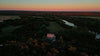 Sky view of farm and barn at dusk